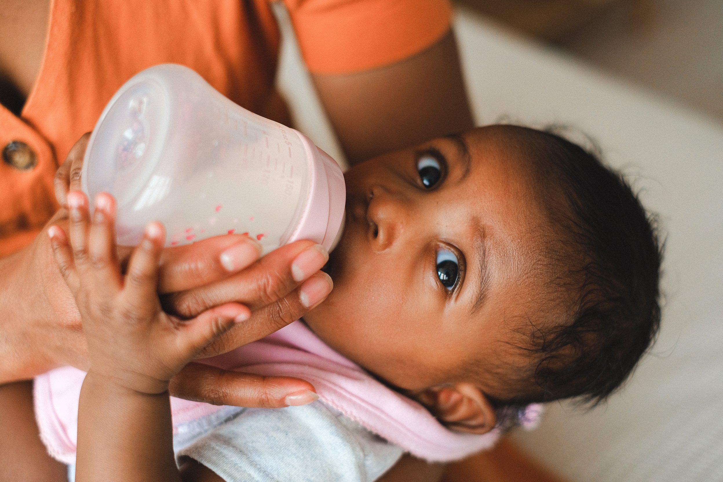 Baby Drinking Milk on Feeding Bottle